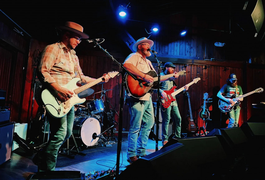 Band performing on stage at night