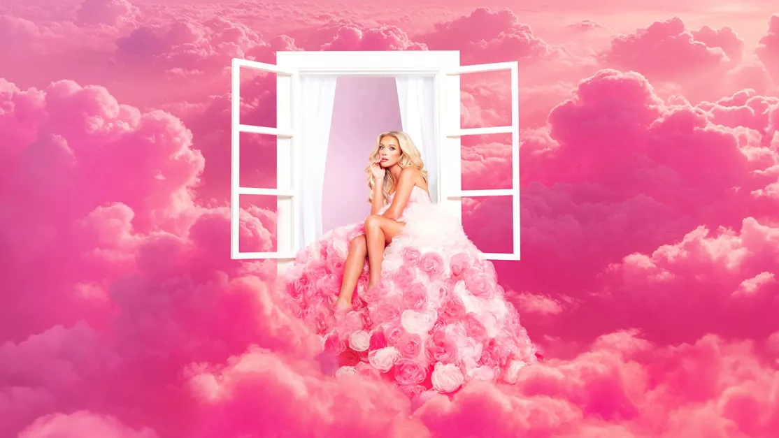 Megan Moroney in the pink cloud-themed visual for her Cloud 9 era
