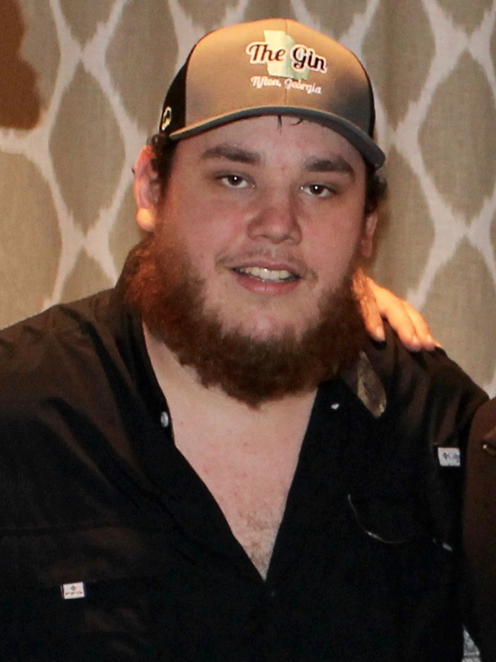 Portrait of Luke Combs in a cap and black shirt before a 2016 show in Athens, Georgia